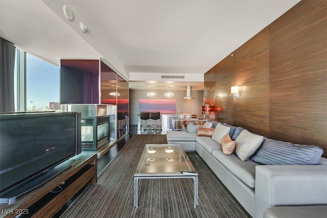 4381 W Flamingo Rd Unit 1101, Las Vegas, NV 89103 - living room with wood walls