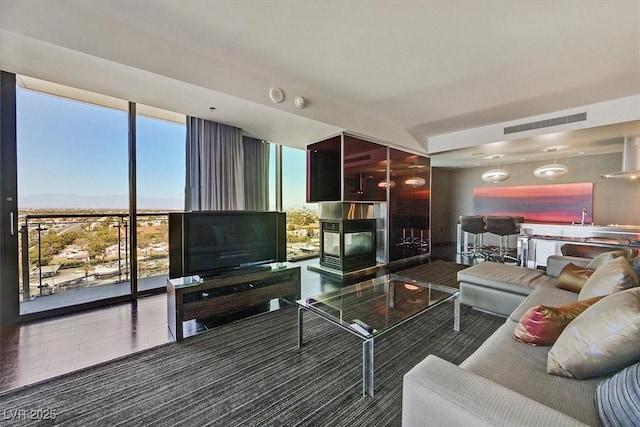 4381 W Flamingo Rd Unit 1101, Las Vegas, NV 89103 - living room with a wall of windows