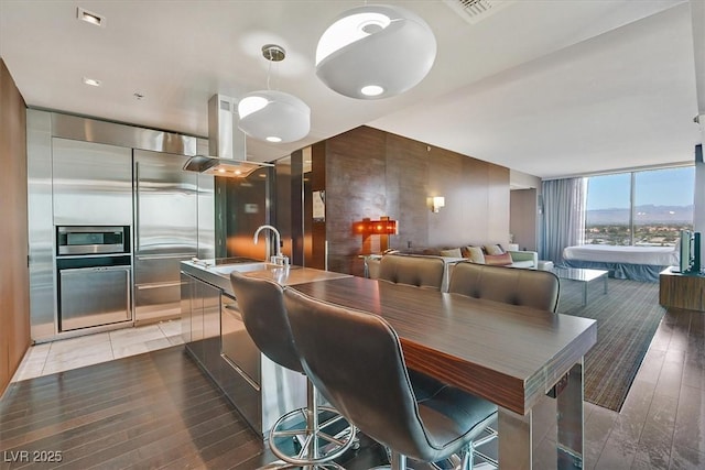4381 W Flamingo Rd Unit 1101, Las Vegas, NV 89103 - dining room featuring light wood-type flooring