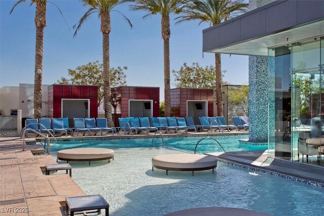 4381 W Flamingo Rd Unit 1101, Las Vegas, NV 89103 - community pool featuring a patio area