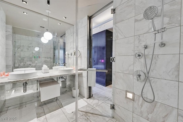 4381 W Flamingo Rd Unit 1101, Las Vegas, NV 89103 - full bath with tile walls, tiled shower, double vanity, and marble finish floors