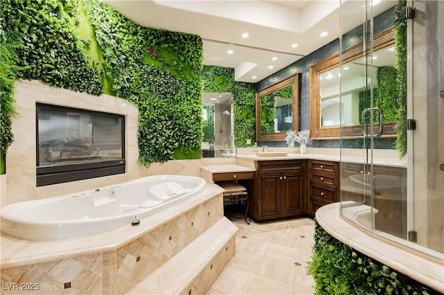 7625 Coley Ave, Las Vegas, NV 89117 - bathroom featuring vanity, a bath, a stall shower, and recessed lighting