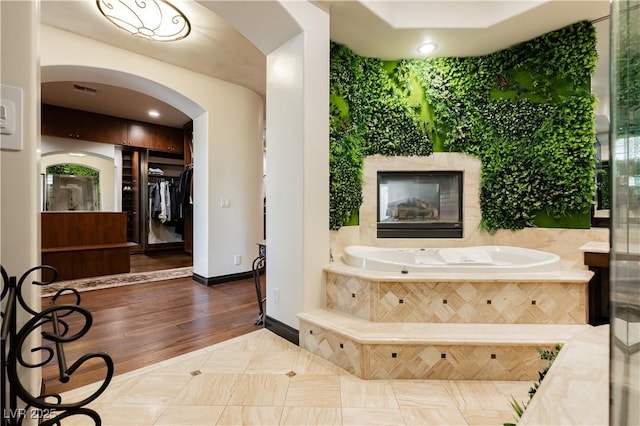 7625 Coley Ave, Las Vegas, NV 89117 - full bathroom with a garden tub, baseboards, and tile patterned floors