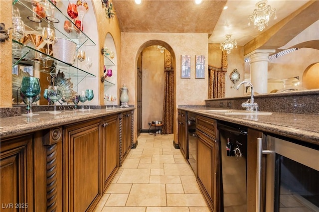 7625 Coley Ave, Las Vegas, NV 89117 - indoor bar featuring arched walkways, beverage cooler, recessed lighting, and light stone finish flooring