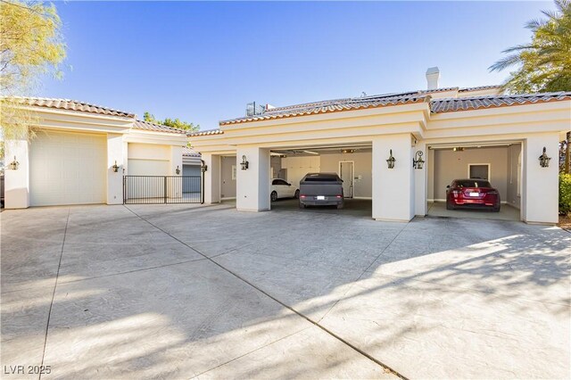 7625 Coley Ave, Las Vegas, NV 89117 - view of front of house featuring stucco siding, driveway, a garage, and a tiled roof