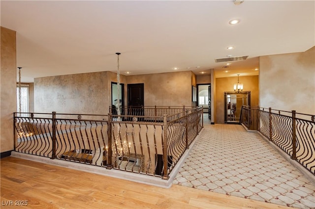 7625 Coley Ave, Las Vegas, NV 89117 - hall with an upstairs landing, a chandelier, wood finished floors, and recessed lighting