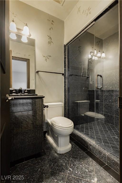 7625 Coley Ave, Las Vegas, NV 89117 - bathroom with toilet, vanity, and a shower stall