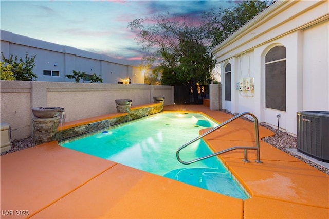 7625 Coley Ave, Las Vegas, NV 89117 - pool at dusk with central AC unit, a fenced backyard, and a patio