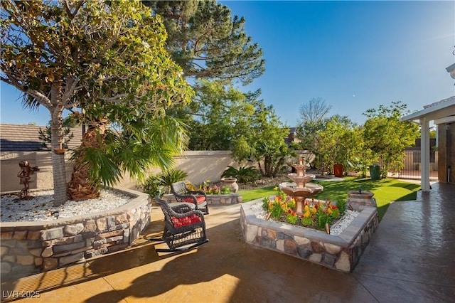 7625 Coley Ave, Las Vegas, NV 89117 - fenced backyard with a patio area