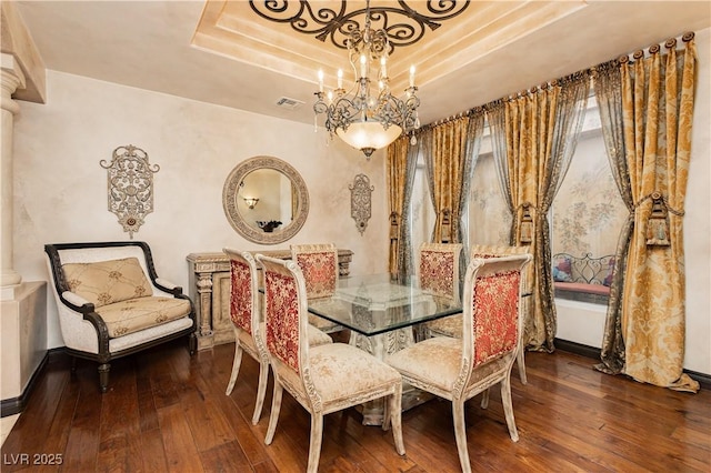 7625 Coley Ave, Las Vegas, NV 89117 - dining area with a raised ceiling, hardwood / wood-style floors, and a chandelier