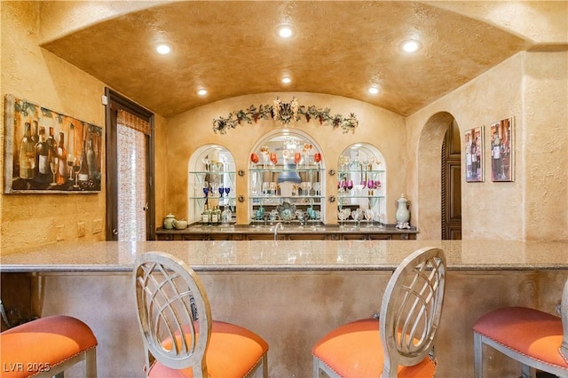7625 Coley Ave, Las Vegas, NV 89117 - indoor dry bar featuring lofted ceiling, recessed lighting, and a textured wall