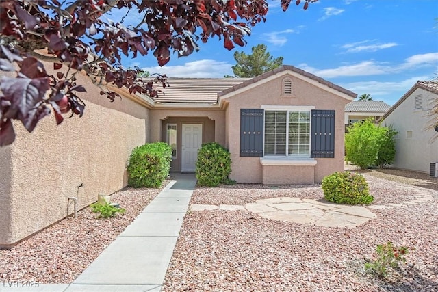 2573 Grandville Ave, Henderson, NV 89052 - doorway to property with stucco siding and a tiled roof
