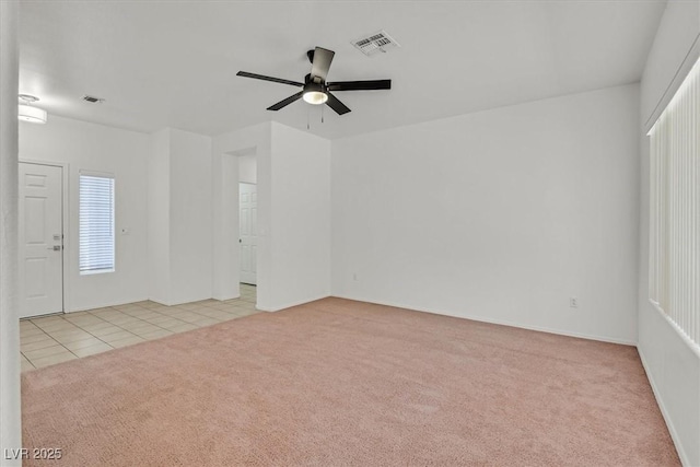 2573 Grandville Ave, Henderson, NV 89052 - tiled spare room featuring carpet, a ceiling fan, and baseboards