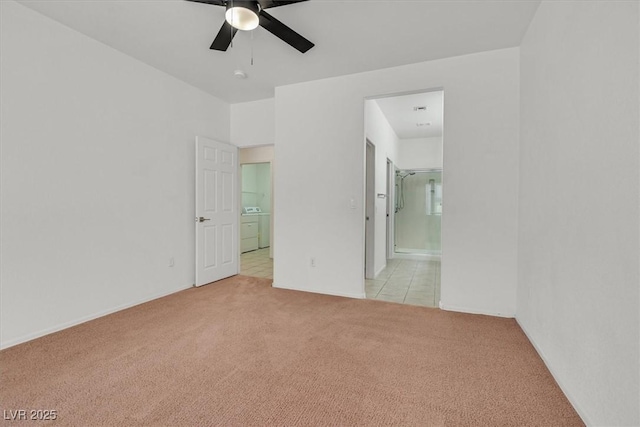 2573 Grandville Ave, Henderson, NV 89052 - unfurnished room with light carpet, a ceiling fan, and washer and dryer