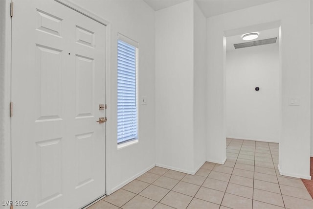 2573 Grandville Ave, Henderson, NV 89052 - foyer with plenty of natural light, light tile patterned flooring, and baseboards