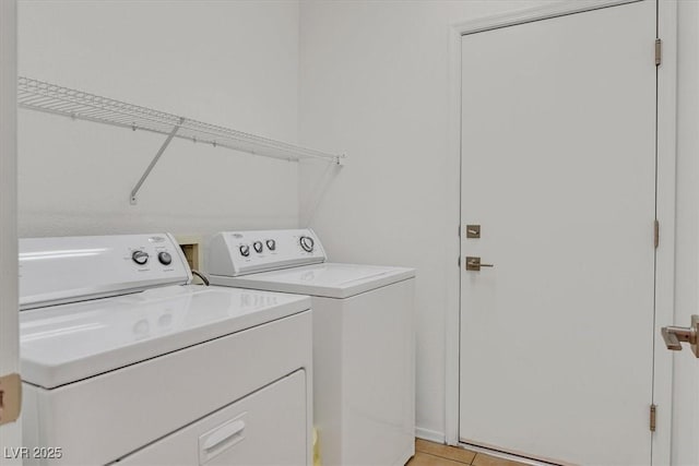 2573 Grandville Ave, Henderson, NV 89052 - laundry room featuring washing machine and clothes dryer and light tile patterned floors