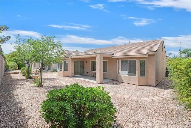2573 Grandville Ave, Henderson, NV 89052 - back of property with stucco siding, a tiled roof, and a patio area