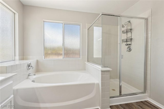 914 Appaloosa Hills Ave, North Las Vegas, NV 89081 - bathroom with vanity, a stall shower, a bath, and wood finished floors