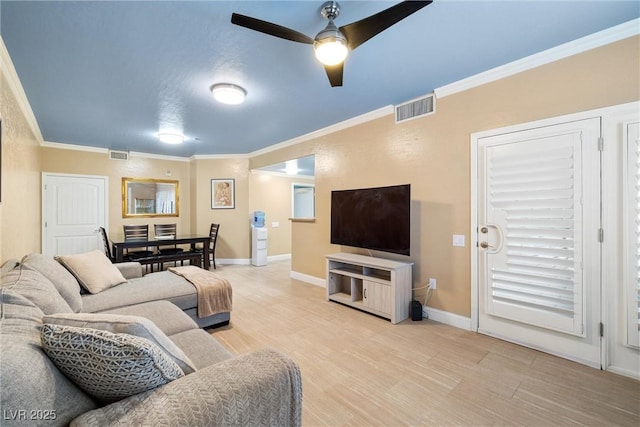 6655 Flaminian Ln Unit 104, North Las Vegas, NV 89084 - living area featuring ornamental molding, a ceiling fan, light wood finished floors, and baseboards