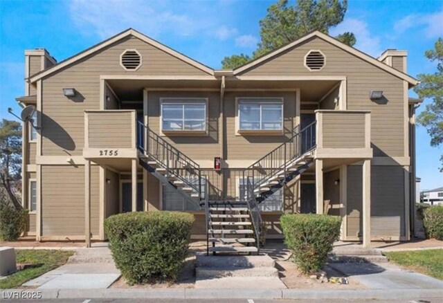 2755 Jennydiane Dr, Las Vegas, NV 89121 - townhome / multi-family property featuring a chimney and stairway