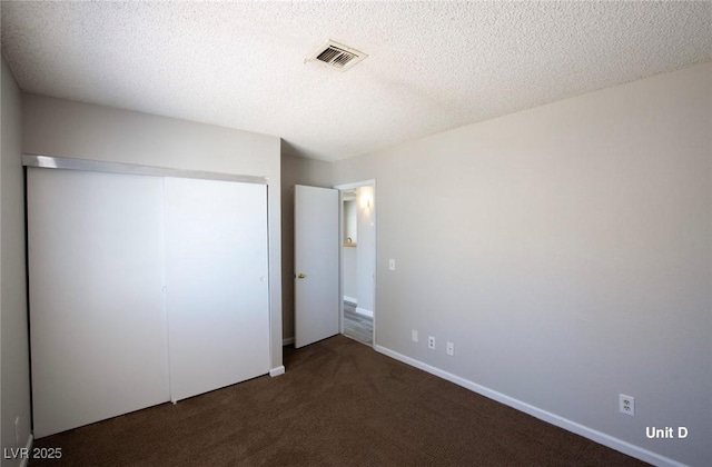2755 Jennydiane Dr, Las Vegas, NV 89121 - unfurnished bedroom with carpet, a closet, a textured ceiling, and baseboards