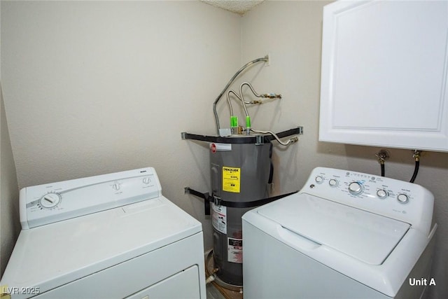 2755 Jennydiane Dr, Las Vegas, NV 89121 - laundry room with electric water heater, cabinet space, and washing machine and clothes dryer