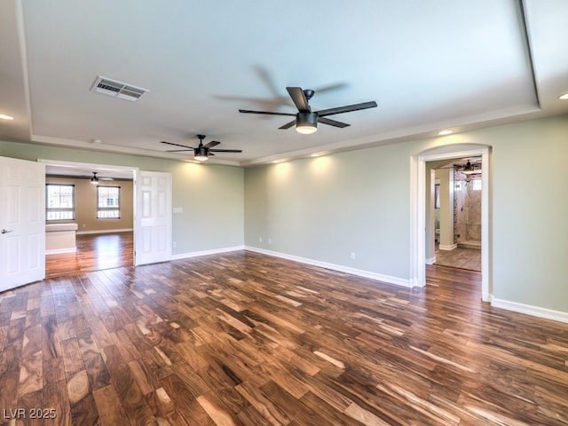 6779 Goose Watch Ct, Las Vegas, NV 89139 - unfurnished room featuring a ceiling fan, dark wood-style floors, a tray ceiling, and recessed lighting