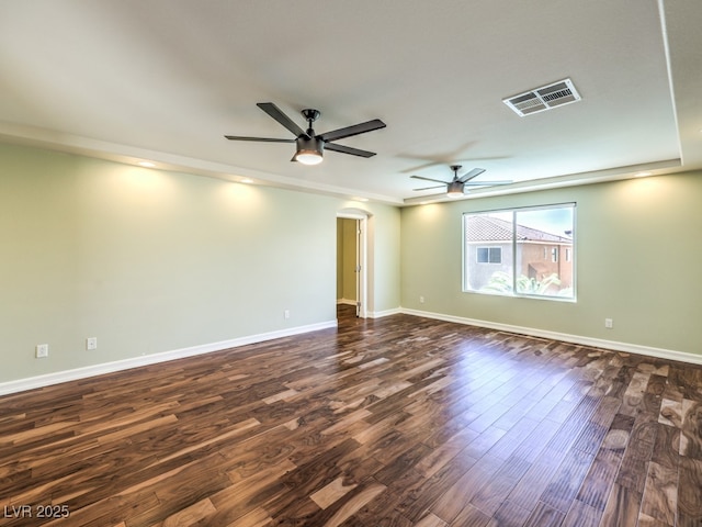 6779 Goose Watch Ct, Las Vegas, NV 89139 - spare room with ceiling fan, dark wood-style flooring, and arched walkways