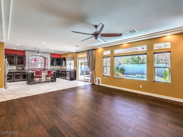 6779 Goose Watch Ct, Las Vegas, NV 89139 - unfurnished living room featuring a ceiling fan, light wood-style flooring, and recessed lighting