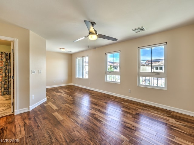 6779 Goose Watch Ct, Las Vegas, NV 89139 - spare room with dark wood-type flooring and a ceiling fan