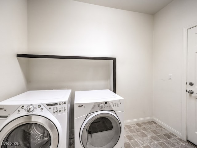 6779 Goose Watch Ct, Las Vegas, NV 89139 - laundry area with washing machine and dryer and baseboards