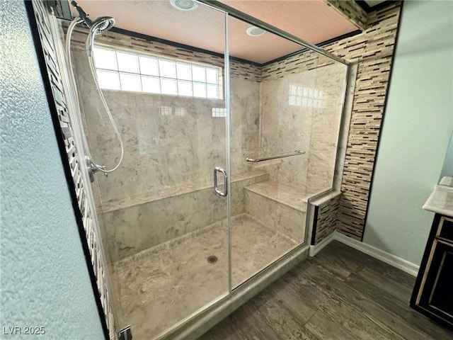 6779 Goose Watch Ct, Las Vegas, NV 89139 - full bath with a shower stall and wood finished floors