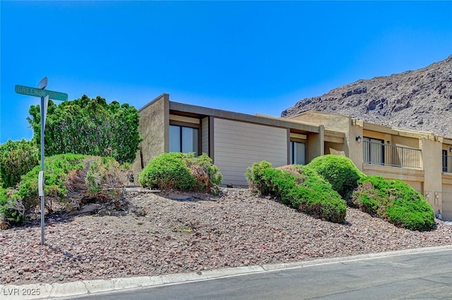 532 Greenbriar Pl, Boulder City, NV 89005 - view of side of property with stucco siding and a mountain view