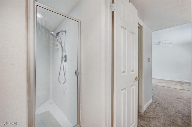 532 Greenbriar Pl, Boulder City, NV 89005 - bathroom with a shower stall, a ceiling fan, and baseboards