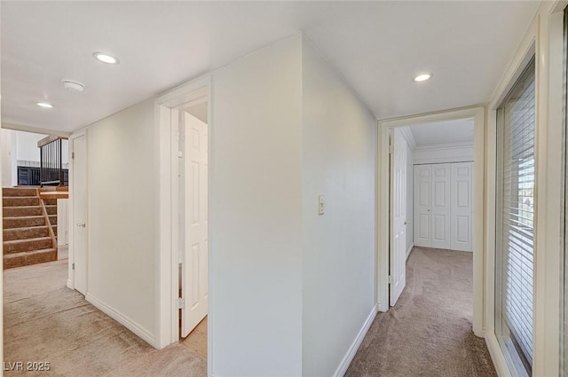 532 Greenbriar Pl, Boulder City, NV 89005 - hallway with light colored carpet, baseboards, recessed lighting, and stairway