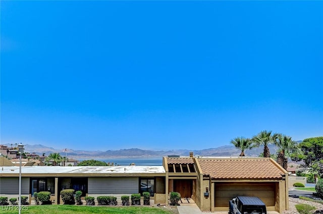 532 Greenbriar Pl, Boulder City, NV 89005 - view of front of house featuring a mountain view, a garage, and a tile roof