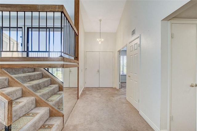 532 Greenbriar Pl, Boulder City, NV 89005 - entrance foyer featuring a high ceiling, carpet, a chandelier, and stairs