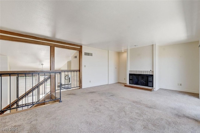 532 Greenbriar Pl, Boulder City, NV 89005 - unfurnished living room featuring a glass covered fireplace and carpet flooring