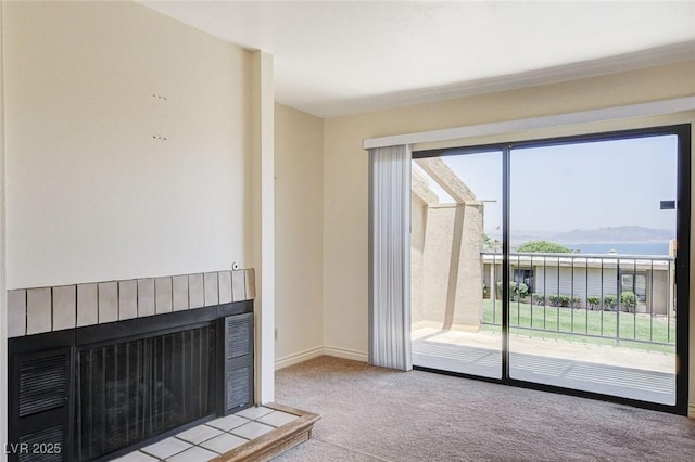 532 Greenbriar Pl, Boulder City, NV 89005 - unfurnished living room featuring carpet floors, a fireplace with raised hearth, and a water view