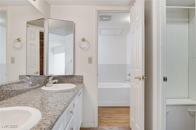 532 Greenbriar Pl, Boulder City, NV 89005 - bathroom with double vanity, wood finished floors, and a garden tub