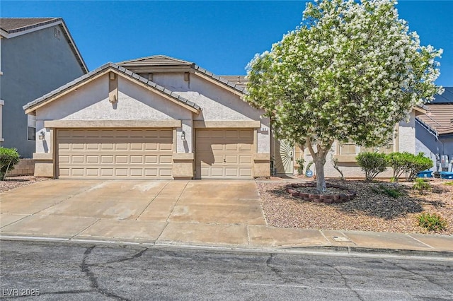 89 Autumn Day St, Henderson, NV 89012 - view of front of property with stucco siding, an attached garage, driveway, and a tile roof