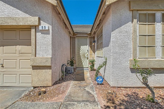 89 Autumn Day St, Henderson, NV 89012 - entrance to property with stucco siding and a garage