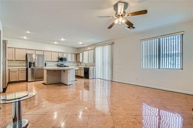 89 Autumn Day St, Henderson, NV 89012 - kitchen featuring appliances with stainless steel finishes, light countertops, a kitchen island, a ceiling fan, and recessed lighting