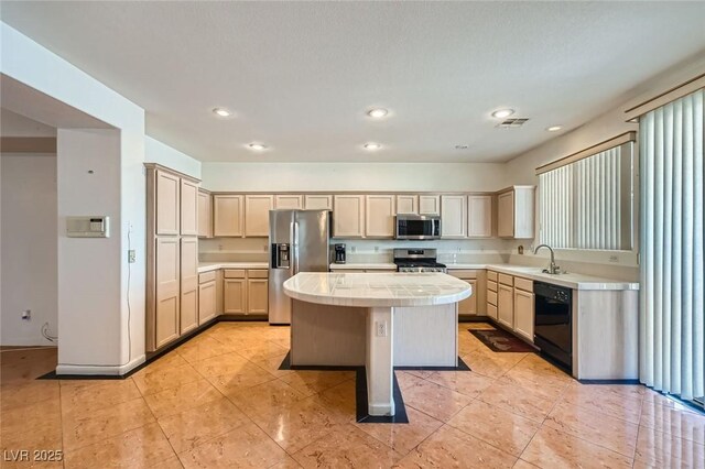 89 Autumn Day St, Henderson, NV 89012 - kitchen featuring stainless steel appliances, a kitchen island, tile counters, recessed lighting, and light brown cabinetry
