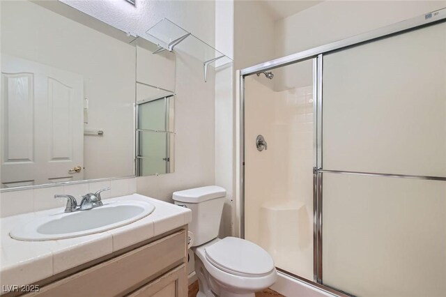 89 Autumn Day St, Henderson, NV 89012 - bathroom with toilet, a stall shower, and vanity