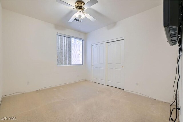 89 Autumn Day St, Henderson, NV 89012 - unfurnished bedroom with carpet, a closet, and a ceiling fan