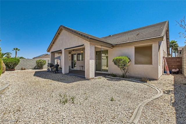 89 Autumn Day St, Henderson, NV 89012 - back of house featuring a fenced backyard, ceiling fan, stucco siding, and a patio area