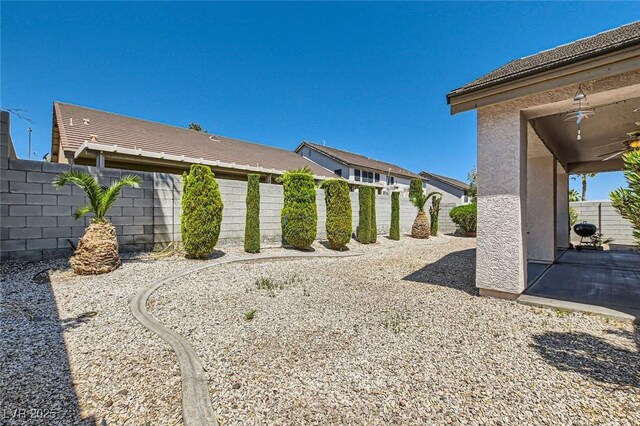 89 Autumn Day St, Henderson, NV 89012 - fenced backyard with a patio and a ceiling fan