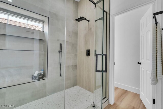 3109 Siena Cir, Las Vegas, NV 89128 - bathroom with a stall shower, baseboards, and wood finished floors
