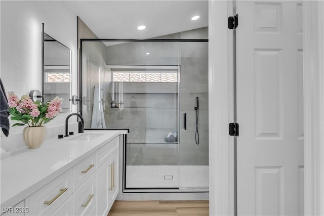3109 Siena Cir, Las Vegas, NV 89128 - bathroom featuring vanity, a shower stall, wood finished floors, and recessed lighting